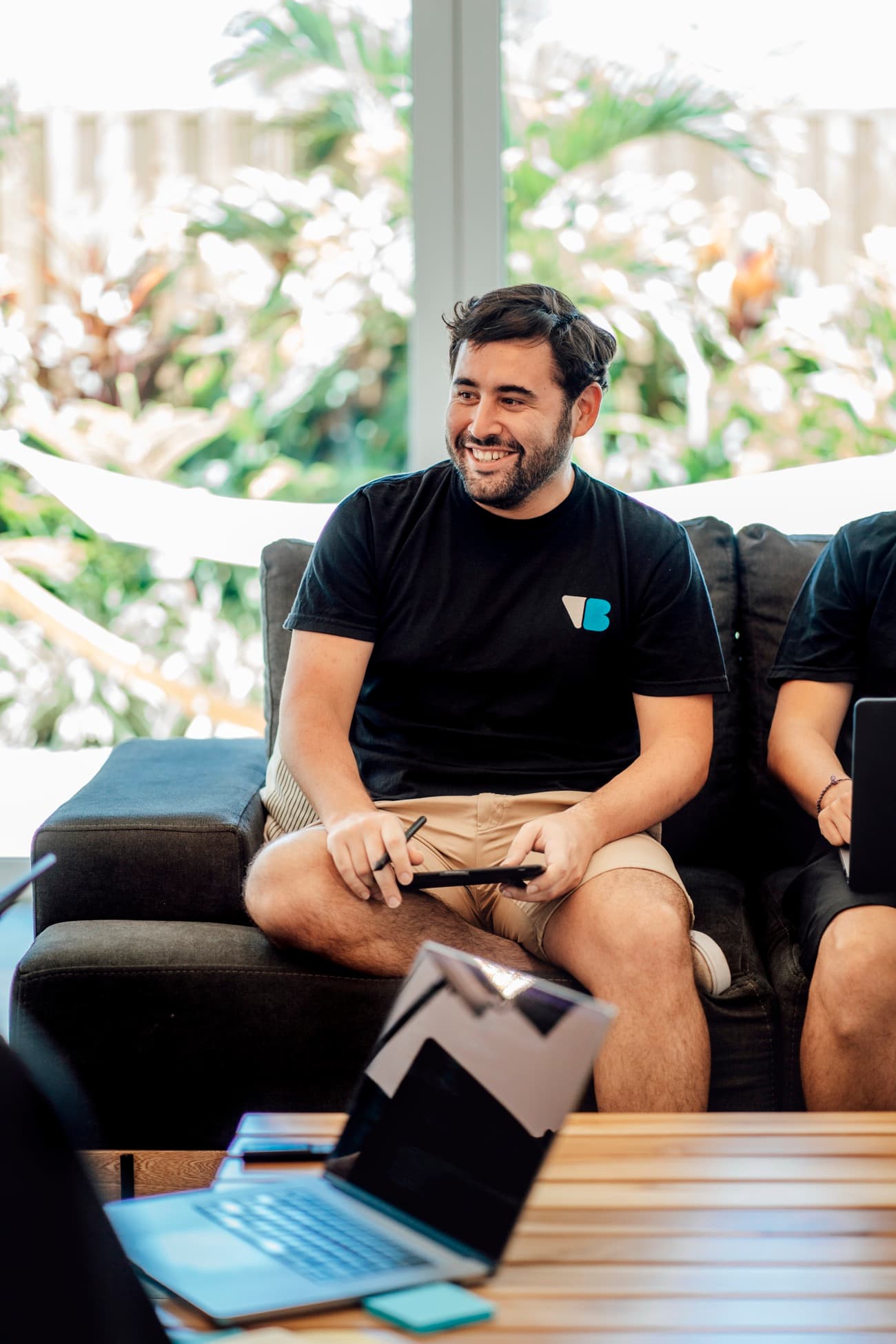 A VisualBoston team member smiling during a working session with the team